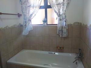 a bath tub in a bathroom with a window at Crayfish Inn no.8 in Ramsgate +18 photos