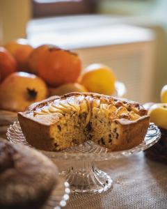 a cake sitting on a glass plate on a table at Antico Convento Dei Cappuccini in Ragusa