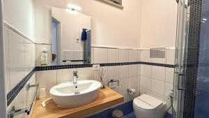 a bathroom with a sink and a toilet at Torre Letus in Montallegro