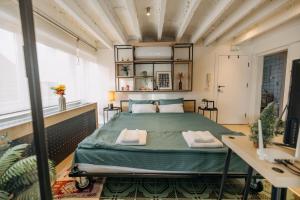 a bedroom with a large bed in a room at Studio49apartments Quiet in Niš Free Private Parking Fast WiFi in Niš