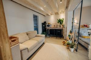 a living room with a couch and a fireplace at Studio49apartments Quiet in Niš Free Private Parking Fast WiFi in Niš