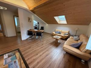 a living room with a couch and a table at Ferienwohnung Kramerblick Marienplatz in Garmisch-Partenkirchen