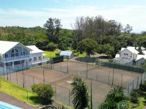 an aerial view of a tennis court at 9 Montego Bay Caribbean Estates in Port Edward