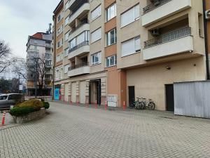 a building on a street with bikes parked next to it at Apartman Vuk in Ćuprija