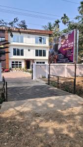 a building with a sign in front of it at White Dove Luxurious Boutique Hotel, within 3 Km from Guwahati Airport in Guwahati