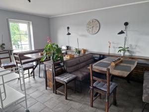 a living room with a couch and a table at Galgenberghof Müncheberg in Müncheberg