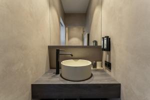 a bathroom with a round sink on a counter at De Rietreiger in Blankenberge +63 photos