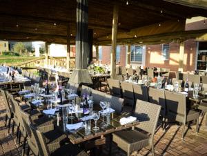 a group of tables and chairs with wine glasses at Hokahanya Inn & Conference Centre in Maseru