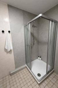 a shower with a glass enclosure in a bathroom at Comfort Stay Koblenz in Koblenz