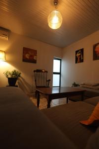 a living room with a table and a couch at Villa 18 Hostel in Tirana