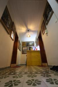 a hallway with a door and a room with a floor at Villa 18 Hostel in Tirana +18 photos