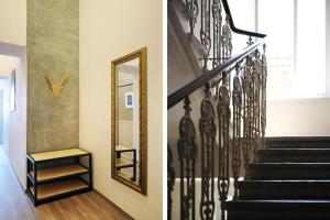 a stairway with a mirror and a stair case at Urban Jungle in Brno
