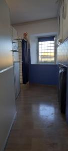 a hallway of an empty room with a window at I Love Host 24 in Montefiascone