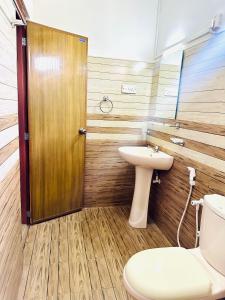 a bathroom with a toilet and a sink at Dreamy Homestay in Anuradhapura +21 photos