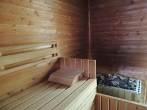 a wooden sauna with a bench in it at MEANDER THERMAL & SKI REZORT ORAVICE in Oravice