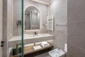 a bathroom with a sink and a mirror at Panorama Kakheti Resort in Gurjaani