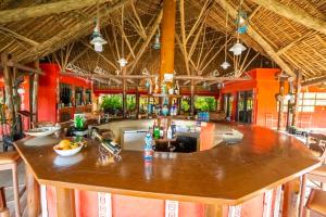 a large kitchen with a bar in a resort at Muthu Mara River Lodge in Masai Mara