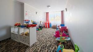 a childs room with many toys in it at Welle Resort, Sun & Snow in Grzybowo