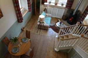 an overhead view of a living room with a table at School Room in Lochgilphead