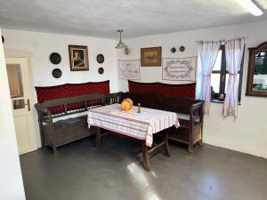 a dining room with a table with a pumpkin on it at Kotlós Tanya in Zákányszék +23 photos