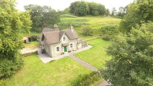 an aerial view of an old house in a field at The School House in Lochgilphead