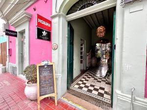 a store with a sign in front of a building at Habitacion olas altas in Mazatlán +5 photos