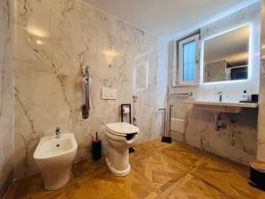 a bathroom with a toilet and a sink at La Dimora del Generale in Pizzo