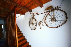a bike hanging on a wall next to a staircase at Villa Nina Labin-The oasis of peace in Labin