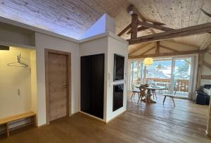a living room with a kitchen and a dining room at Ferienwohnung Haus Bader in Garmisch-Partenkirchen