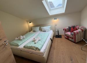a bedroom with a bed with two babies on it at Ferienwohnung Haus Bader in Garmisch-Partenkirchen