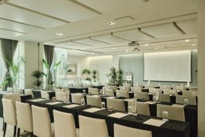 a conference room with a long table and chairs at Hospes Palau de La Mar, Valencia, a Member of Design Hotels in Valencia +74 photos