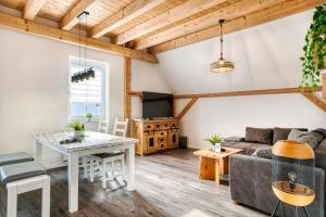 a living room with a couch and a table at Ferienwohnungen Etzl in Bad Mergentheim