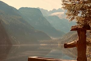 a view of a lake with mountains in the background at SEIN Boutique Suites - ADULTS ONLY in Gosau