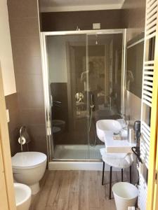 a bathroom with a shower and a toilet at B&B Bruna in Florence