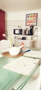 a glass table with a chicken on top of it at Chez Ninon in Freyming +23 photos