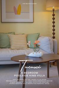 a living room with a coffee table and a couch at The Delfini Hua Hin in Hua Hin