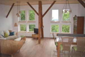 a living room with a couch and a table at Ferienwohnung Ruf in Küps