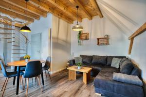 a living room with a couch and a table at Ferienwohnungen Etzl in Bad Mergentheim