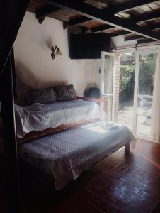 a bedroom with a large bed in a room at Laitale Uturu in San Salvador de Jujuy