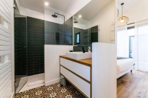 a bathroom with a sink and a shower at BLOOMY - Villa Biarritz in Biarritz +12 photos