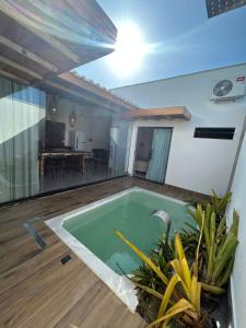 a small swimming pool in the middle of a house at Casa Green Ville in Prado
