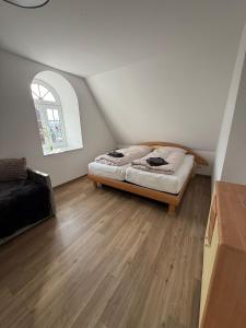 a bedroom with a bed in a attic at Hof Volkmann in Nordkirchen