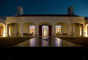 a night view of the front of a building at Estancia VIK José Ignacio in José Ignacio