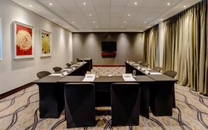 a conference room with a long table and chairs at Garden Court Hatfield in Pretoria +32 photos