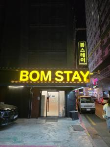 a sign that reads born stay on a building at Bom Stay in Seoul