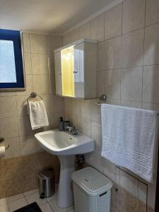 a bathroom with a sink and a mirror at Blue View in Livadia