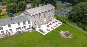 an aerial view of a large house on a lawn at Waterfoot Park in Pooley Bridge