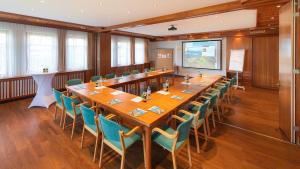 a large conference room with a long table and chairs at Hotel Marko in Sankt Kanzian +35 photos