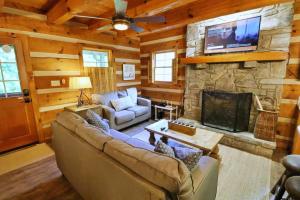 a living room with a couch and a fireplace at The Cove in Canton