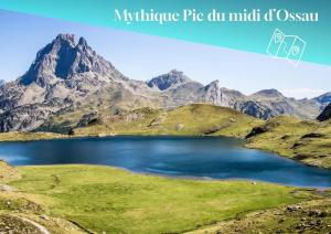 a mountain lake in the middle of a mountain range at Studio Anouk 4 personnes à Laruns in Laruns